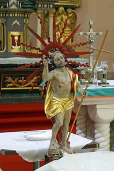 The Risen Christ, a statue on the main altar in the parish church Assumption of the Virgin Mary in Pregrada, Croatia