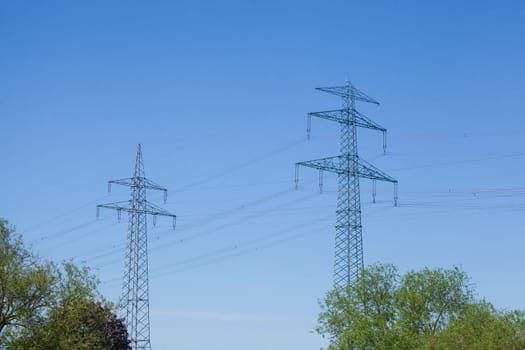 Electricity pylons on the River Este, Buxtehude, Lower Saxony, Germany