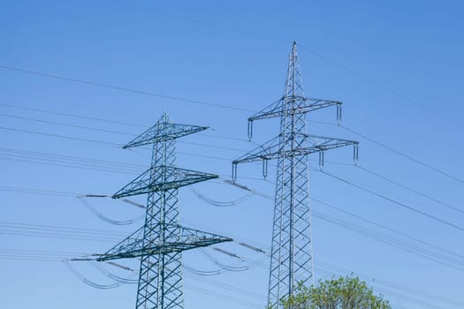 Electricity pylons on the River Este, Buxtehude, Lower Saxony, Germany