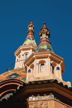 Lloret de Mar, Catalonia, Spain, 02 Oct 2019 The spires of the parish church of Sant Roma in Lloret de Mar near the Costa Brava. Beautiful mosaic building on a sunny day.