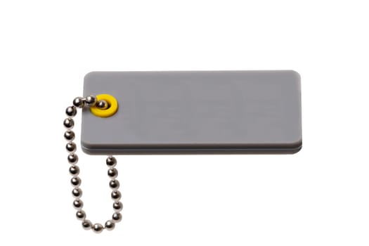 Blank gray plastic tag with chain isolated on a white background. Price or gift tag. Adress label. Clipping path. Space. Macro.