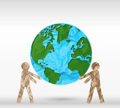 Two paper people holding a planet on a gray background, peace and saving the ecology of planet Earth