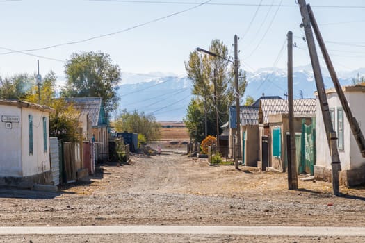 Streets of small Kyrgyz town at sunny autumn day in Balykchy, Kyrgyzstan- October 21, 2022