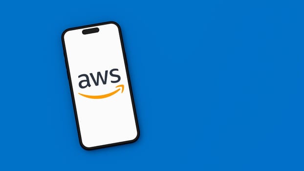 AWS, Amazon Web Services Logo on Mobile Phone Screen on Flat Blue Background with Copy Space 3D Render Illustration, Top View