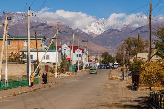 Streets of small Kyrgyz town at sunny autumn day in Balykchy, Kyrgyzstan- October 21, 2022