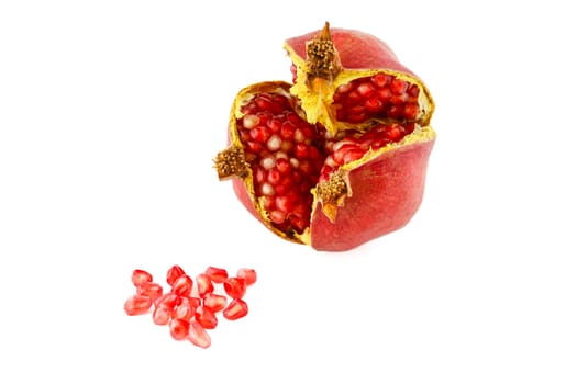 Ripe split pomegranate, one of the fruits with the highest amount of antioxidants. Selective focus with shallow depth of field.