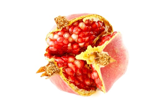 Ripe split pomegranate, one of the fruits with the highest amount of antioxidants. Selective focus with shallow depth of field.