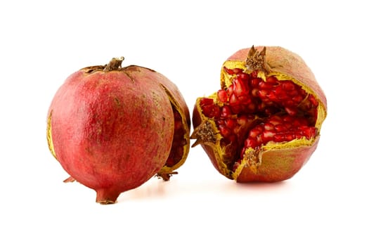 Ripe split pomegranate, one of the fruits with the highest amount of antioxidants. Selective focus with shallow depth of field.