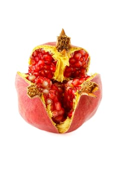 Ripe split pomegranate, one of the fruits with the highest amount of antioxidants. Selective focus with shallow depth of field.