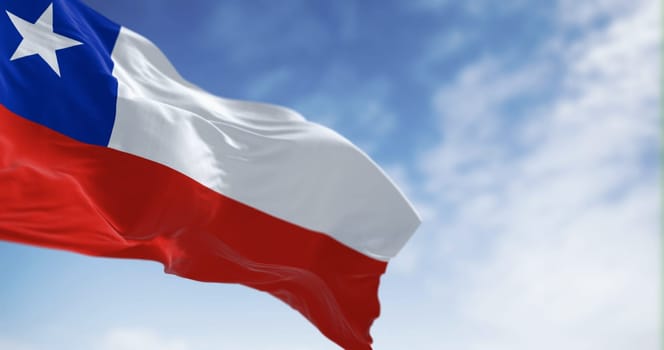 Chile national flag fluttering in the wind on a sunny day. The Chilean flag is red and white with a blue square and white 5-pointed star on the white band. 3d illustration render. Selective focus