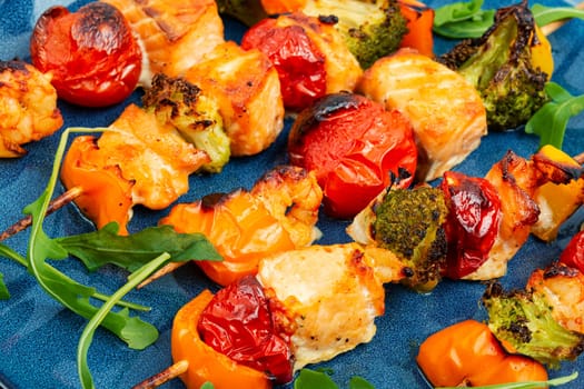 Skewers of fish salmon and vegetables on wooden stick. Seafood kebab. Copy space. Long banner.