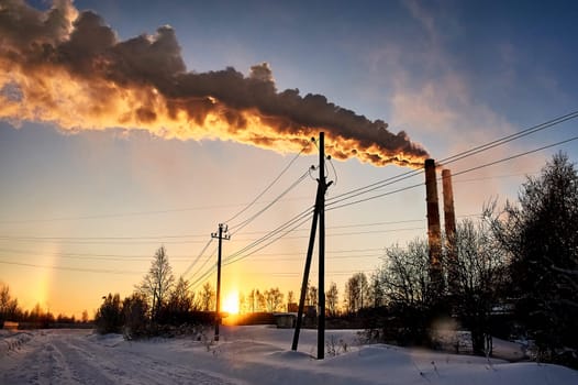 white smoke is coming out of the pipes in the blue sky. High quality photo
