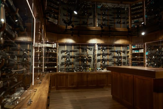 Modern weapon shop interior with guns, handguns, rifles, bullets arsenal. Various choice of advanced weaponry options