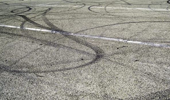 Detail of burnt tire marks on the asphalt, skid