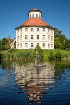 City hall in former water castle of Oppenweiler with lake and fontain