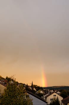 Rainbow weather over homes