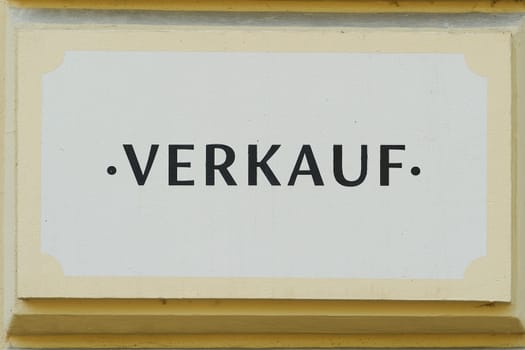 German inscription Verkauf on the facade of a small business in Berlin. Translation: Sale
