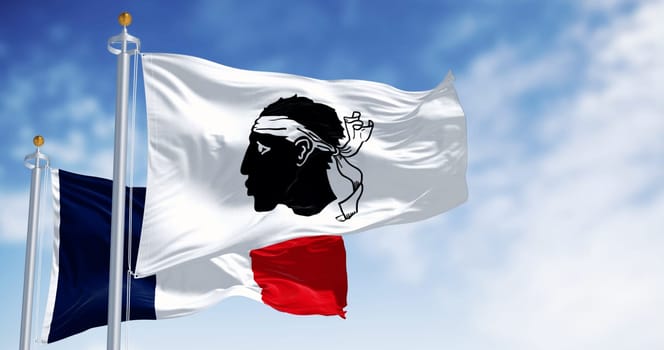 Flag of Corsica waving with national french flag on a clear day. Black Moor's head with a white bandana on a white field. French region. 3d illustration render. Selective focus