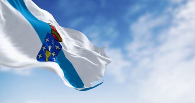 Galicia flag waving on a clear day. Autonomous community of Spain. White with a blue diagonal band with coat of arms on top. 3d illustration render. Selective focus. Fluttering fabric