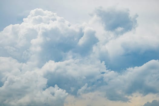 Grey blue sky with white fluffy clouds, natural photography background taken in France