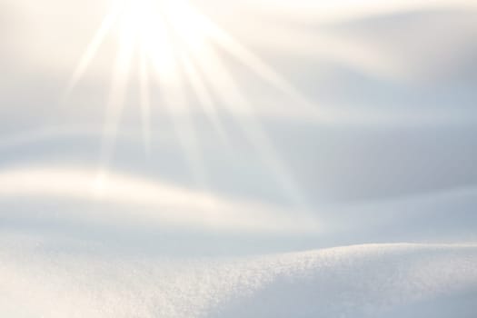 Light rays from the top enlightening the snow on the floor
