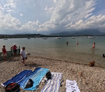 Tourists on the beach of Manerba del Garada on Lake Garda,in the neighboring town of Torri del Benaco,there was a large outbreak with the norovirus  Travel Photography - Lake Garda / Lago di Garda / Italy / Italy / Italia