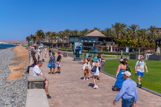 Gran Canaria, Spain - March 20, 2024: People at the Maspalomas coast in Gran Canaria Canary Island.This an important tourist destination on the island