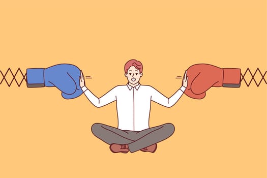 Man business mediator works in conflict management and sits between two boxing gloves. Experienced boss mediator stops dispute corporate employees to avoid decrease in work productivity