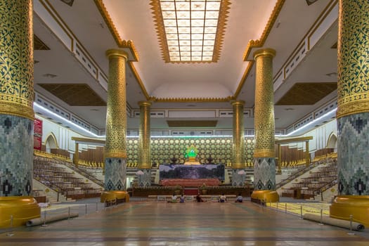 Interior of the Mahapasana Guha Cave and Buddhist Ordination Hall in Yangon, Myanmar. It is adjacent to the Kaba Aye Pagoda. Here, religious examination called the Tipitakadhara Tipitaka Kovida Examinations take place, an extensive recitation, oral and written examination on the Tipitaka, the religious body of works in Theravada Buddhism.