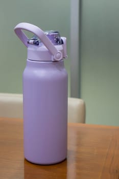Thermos for preservation of a hot or cold drink water bottle, stock photo