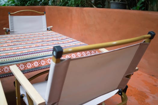 A coffee shop terrace with tables and chairs, stock photo