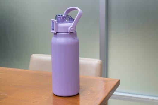 Thermos for preservation of a hot or cold drink water bottle, stock photo