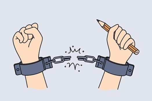 Hands of handcuffed reporter at moment of liberation, holding pencil to write honest investigative journalism. Liberation of man from shackles, as metaphor for emergence of free mass media