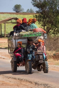 Farm workers transport on a country road in the PaO region of Shan State in Myanmar. The PaO or Pa-Oh (also known as Taungthu and Black Karen) form an ethnic group in Burma, comprising approximately 600,000 people.