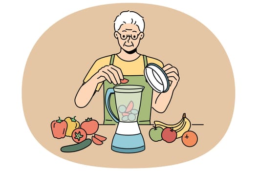 Elderly man uses blender and prepares smoothies from fresh fruits and vegetables in order to stay healthy. Retired man prepares smoothies and follows vitamin diet prescribed by nutritionist doctor