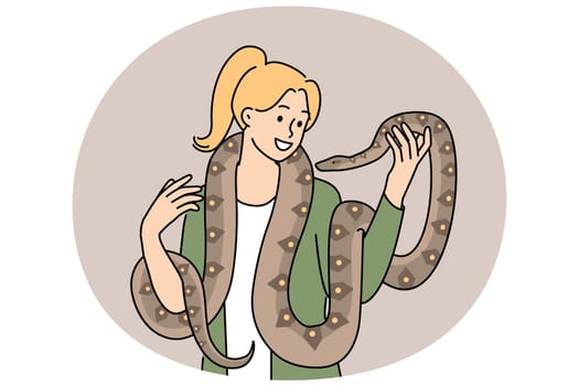 Woman with long snake around neck smiles enjoying communication with beloved pet boa constrictor. Girl holds dangerous predatory snake and does not feel fear at sight of poisonous python