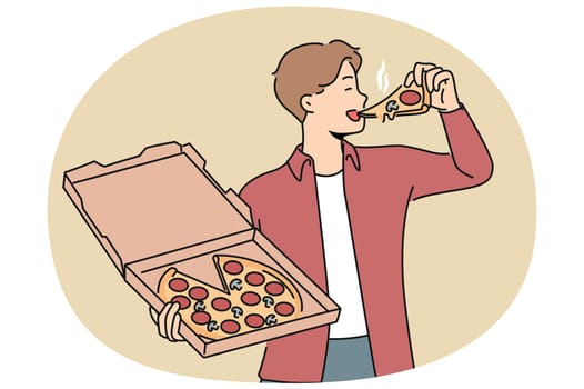 Man bites into pizza and holds box from italian pizzeria, enjoying taste of fresh food delivered from restaurant. Guy satisfies appetite or hunger with delicious pizza with pepperoni and mushrooms