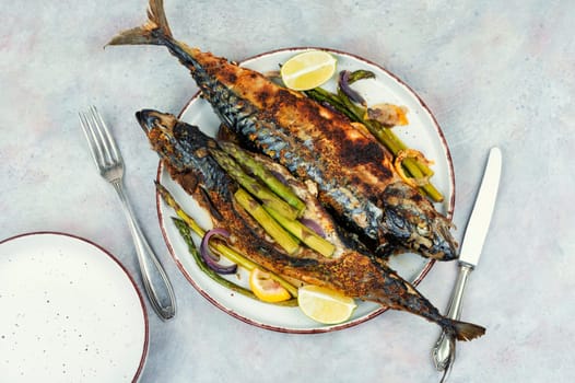 Dietary aromatic mackerel fish barbecue with green asparagus. Flat lay.