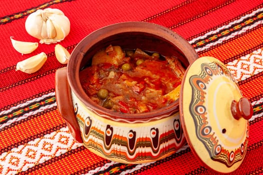 Traditional for the Balkan peoples vegetable dish in a ceramic bowl. Selective focus with shallow depth of field.