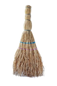 A small household broom for cleaning up waste.