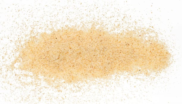 Raw wheat cereal scattered, white background