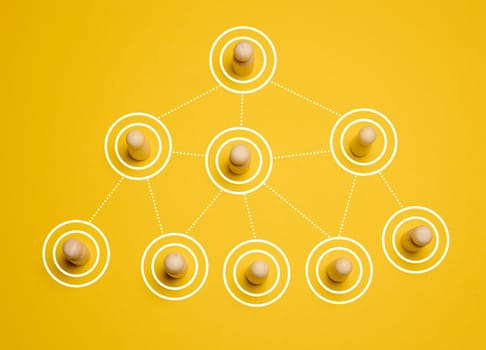 Wooden figures connected by lines, concept of delegation and hierarchy in a company, top view
