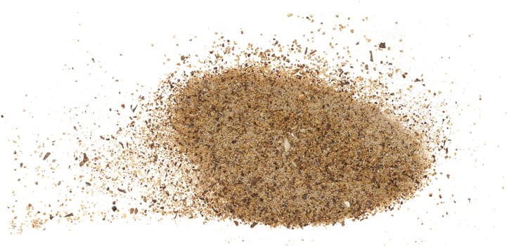 Ground black peppercorns on isolated background, spice