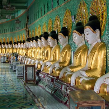 Row of Buddha images inside U Min Thonze Cave - A greatly revered Buddhist temple at Sagaing in Myanmar (Burma)