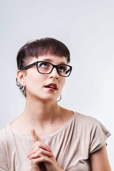 woman, with a dramatic expression and hands clasped, portrays herself as a martyr enduring boredom and minor annoyances. Her exaggerated demeanor reflects a sense of exaggerated suffering