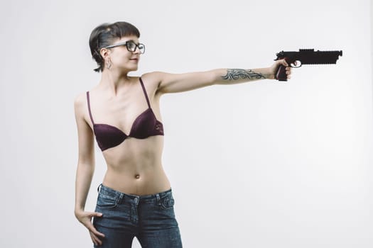 woman in lingerie, holding a gun, embodies the trope of the seductive and lethal spy or vigilante. Her composed stance and focused look add depth to this dangerous yet alluring image