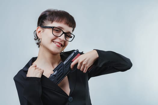 flirtatious woman, embodying a spy-story killer, seductively draws a gun, revealing her attractive figure. Her playful expression and confident stance blend allure with danger in a classic trope