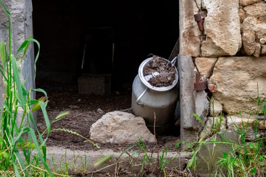 milk jug in an old barn