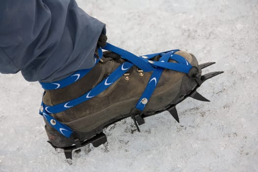Ice climber wearing crampons on the Perito Moreno Glacier in Patagonia in southern Argentina, South America.