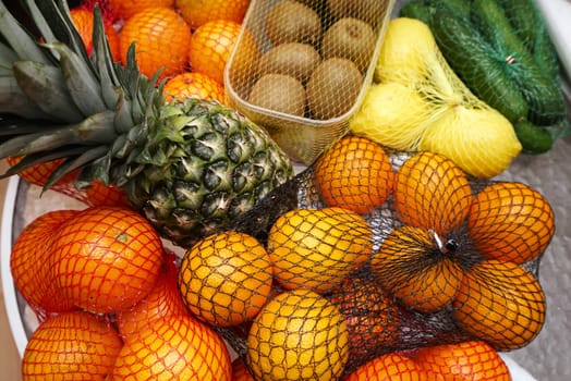 Fruits and vegetables on a table in nets